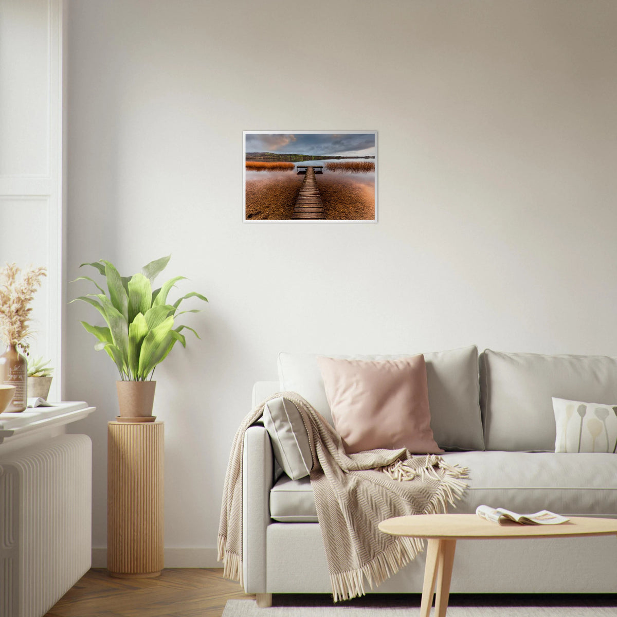 Old Jetty, Lough Derg framed photo print above a cream sofa in a bright living room