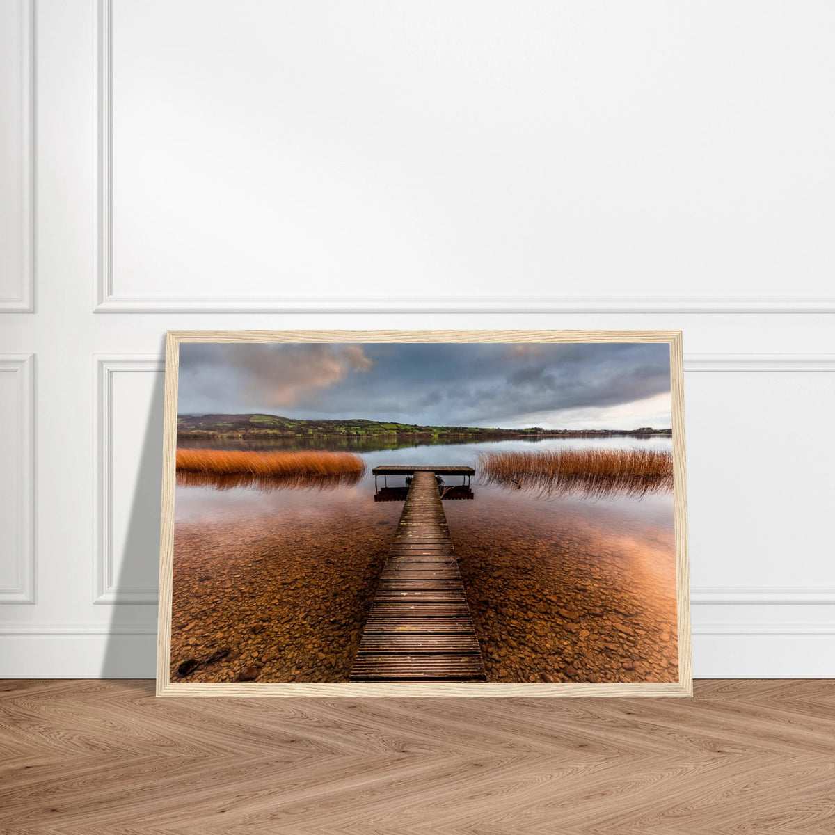 Old Jetty, Lough Derg photographic print in a natural oak frame leaning against a white wall