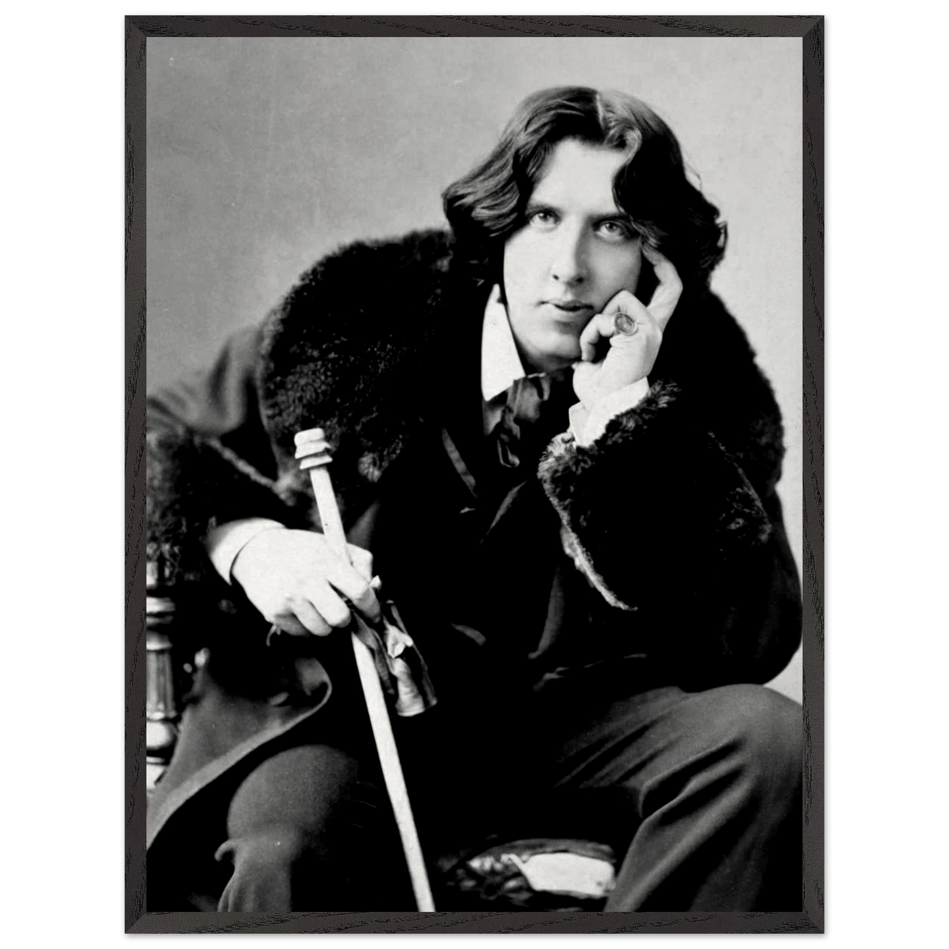Oscar Wilde vintage portrait displayed in a study or library setting
