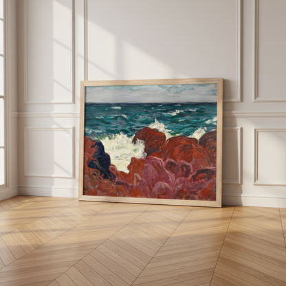 Red Rocks and Sea print in a natural oak frame leaning on a herringbone floor in a panelled white room