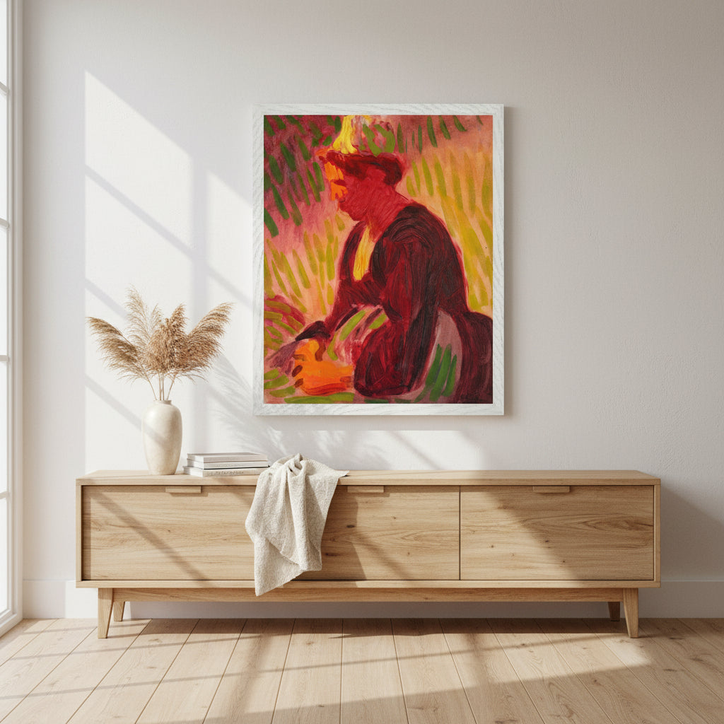 Peasant Woman Seated Outdoors print in a white frame above a light oak sideboard with pampas grass