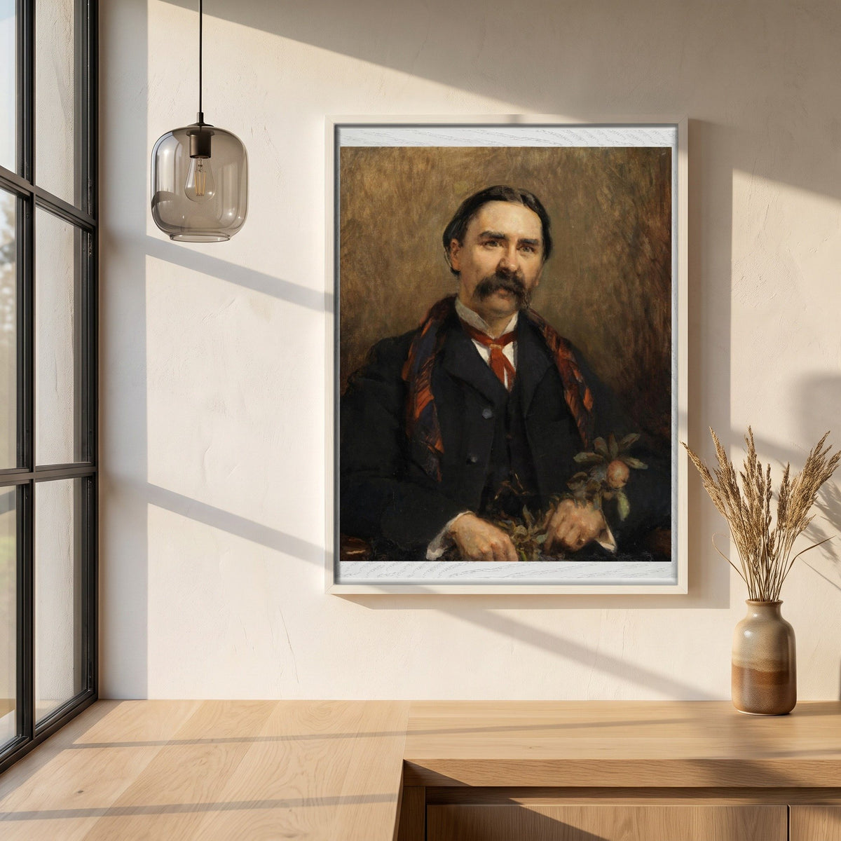 Portrait of Dr Douglas Hyde framed print in a white frame on a plaster wall above an oak worktop in a bright Scandinavian kitchen