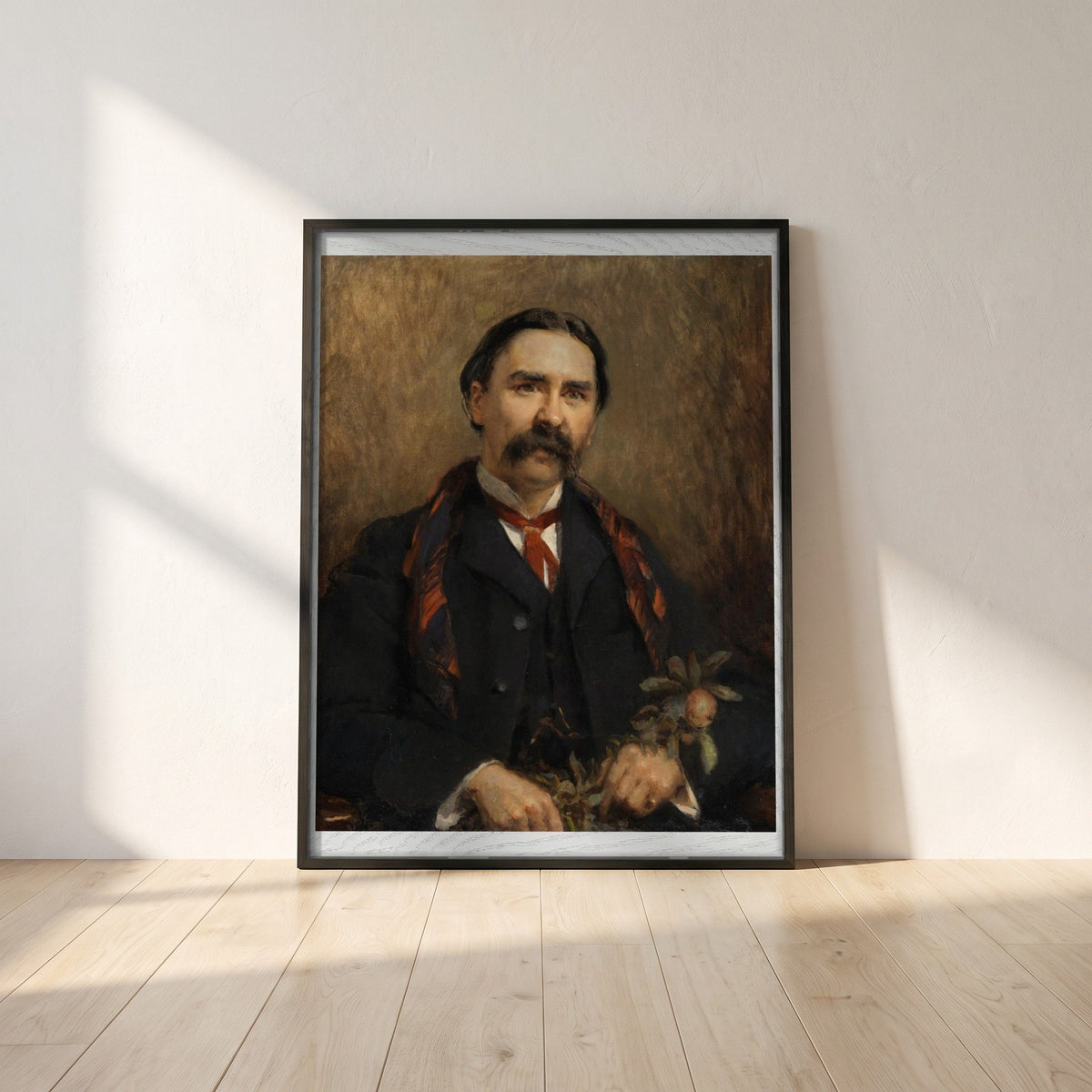 Portrait of Dr Douglas Hyde framed print in a black frame leaning against a white plaster wall on oak floorboards in morning light