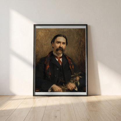 Portrait of Dr Douglas Hyde framed print in a black frame leaning against a white plaster wall on oak floorboards in morning light