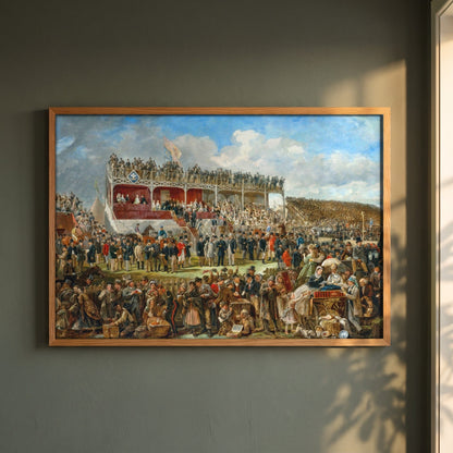 Punchestown Races by John Fergus O'Hea framed print in a natural oak frame on a dark green wall beside a window, dappled plant shadow