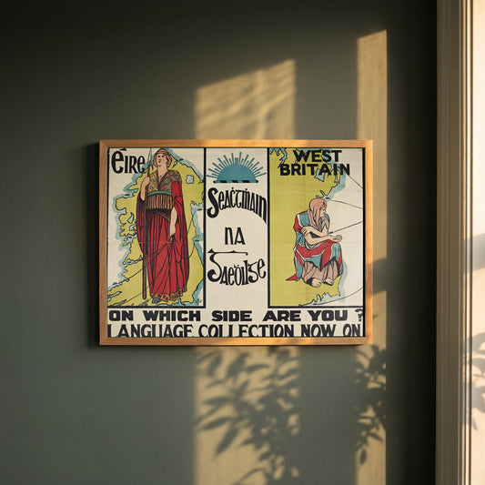Seachtain na Gaeilge framed print in a natural oak frame on a dark green wall beside a window, dappled plant shadow
