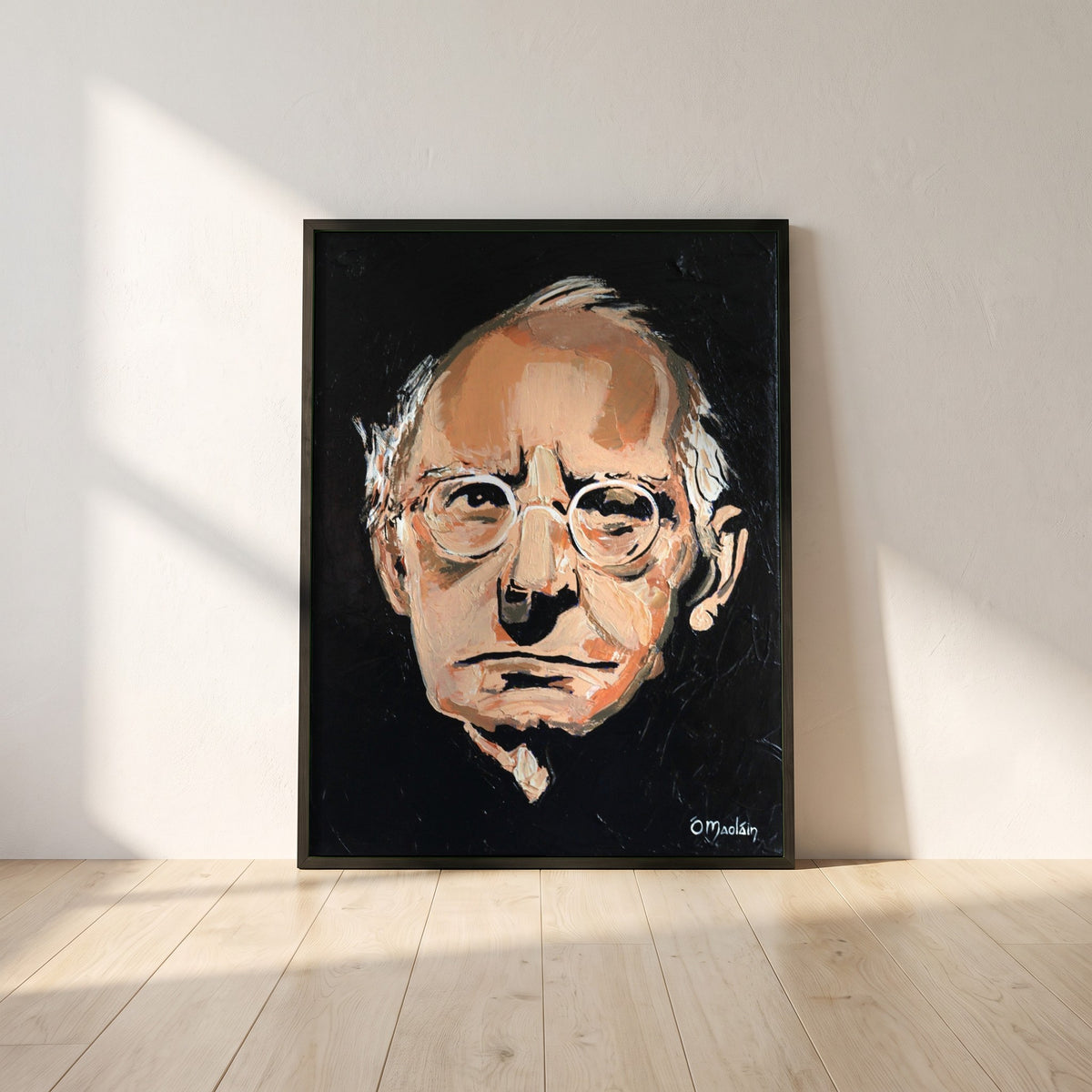 Sean O'Casey framed print in a black frame leaning against a white plaster wall on oak floorboards in morning light