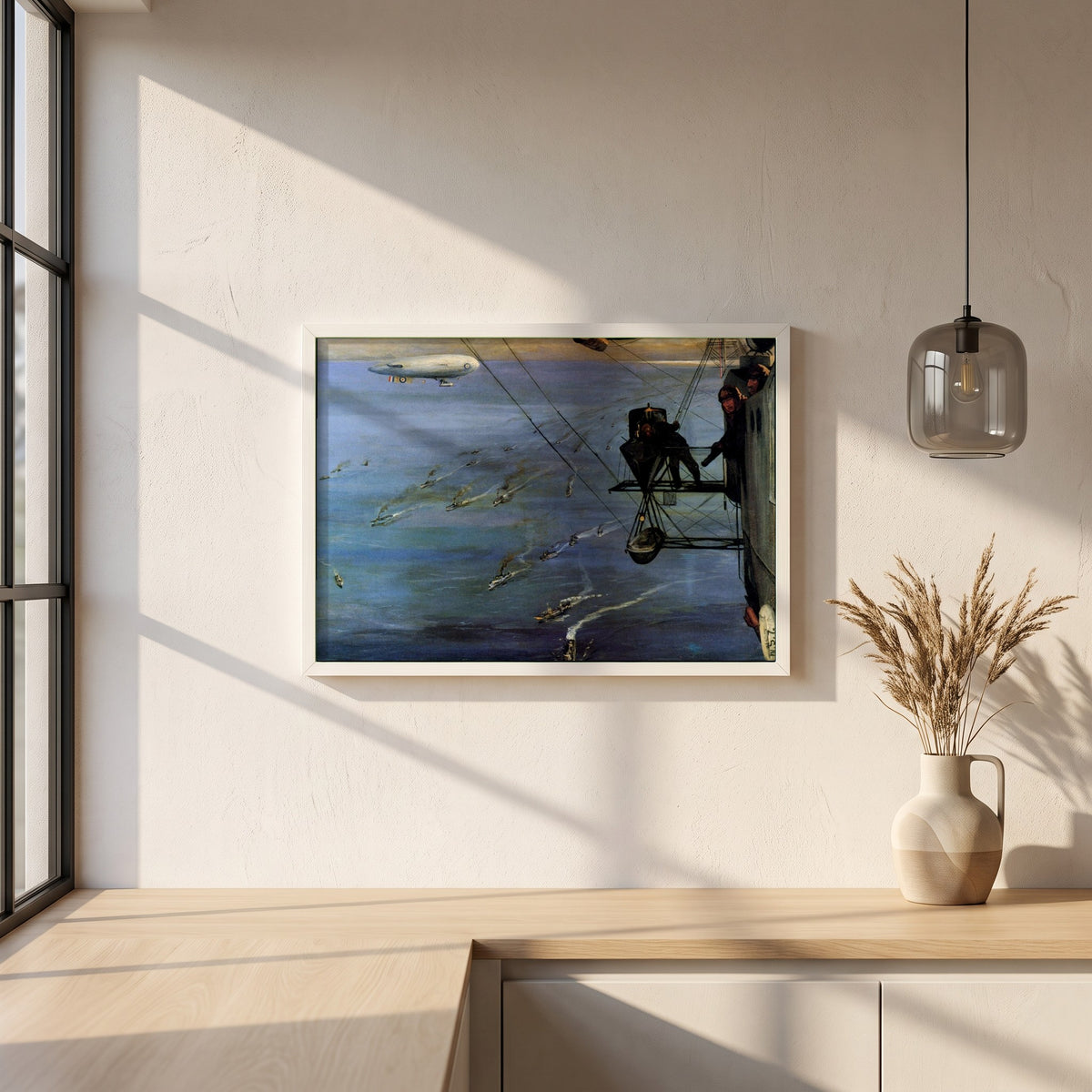 A Convoy, North Sea framed print in a white frame on a plaster wall above an oak worktop in a bright Scandinavian kitchen