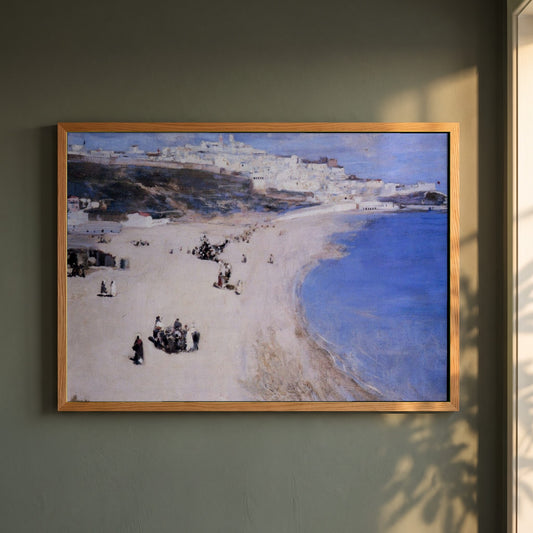 Tangier, The White City framed print in a natural oak frame on a dark green wall beside a window, dappled plant shadow