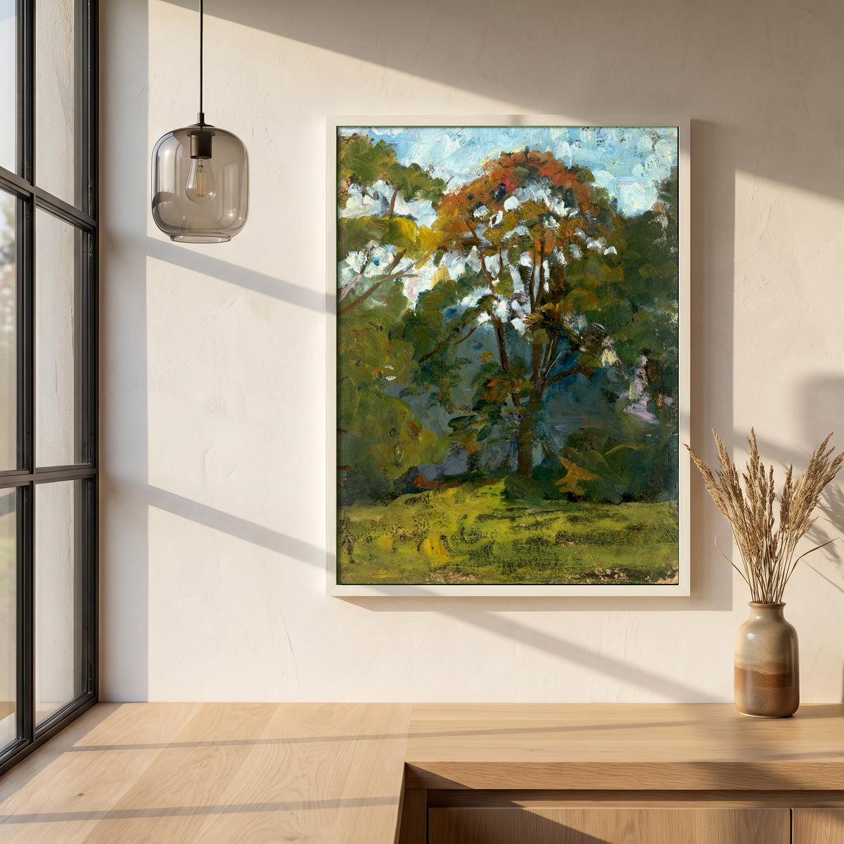 Sketch of Trees framed print in a white frame on a plaster wall above an oak worktop in a bright Scandinavian kitchen