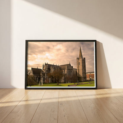St. Patrick's Cathedral Dublin framed print in a black frame leaning against a white plaster wall on oak floorboards in morning light