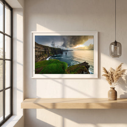 Cliffs of Moher framed print in a white frame on a plaster wall above an oak worktop in a bright Scandinavian kitchen