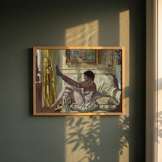 Sunlight framed print in a natural oak frame on a dark green wall beside a window, dappled plant shadow
