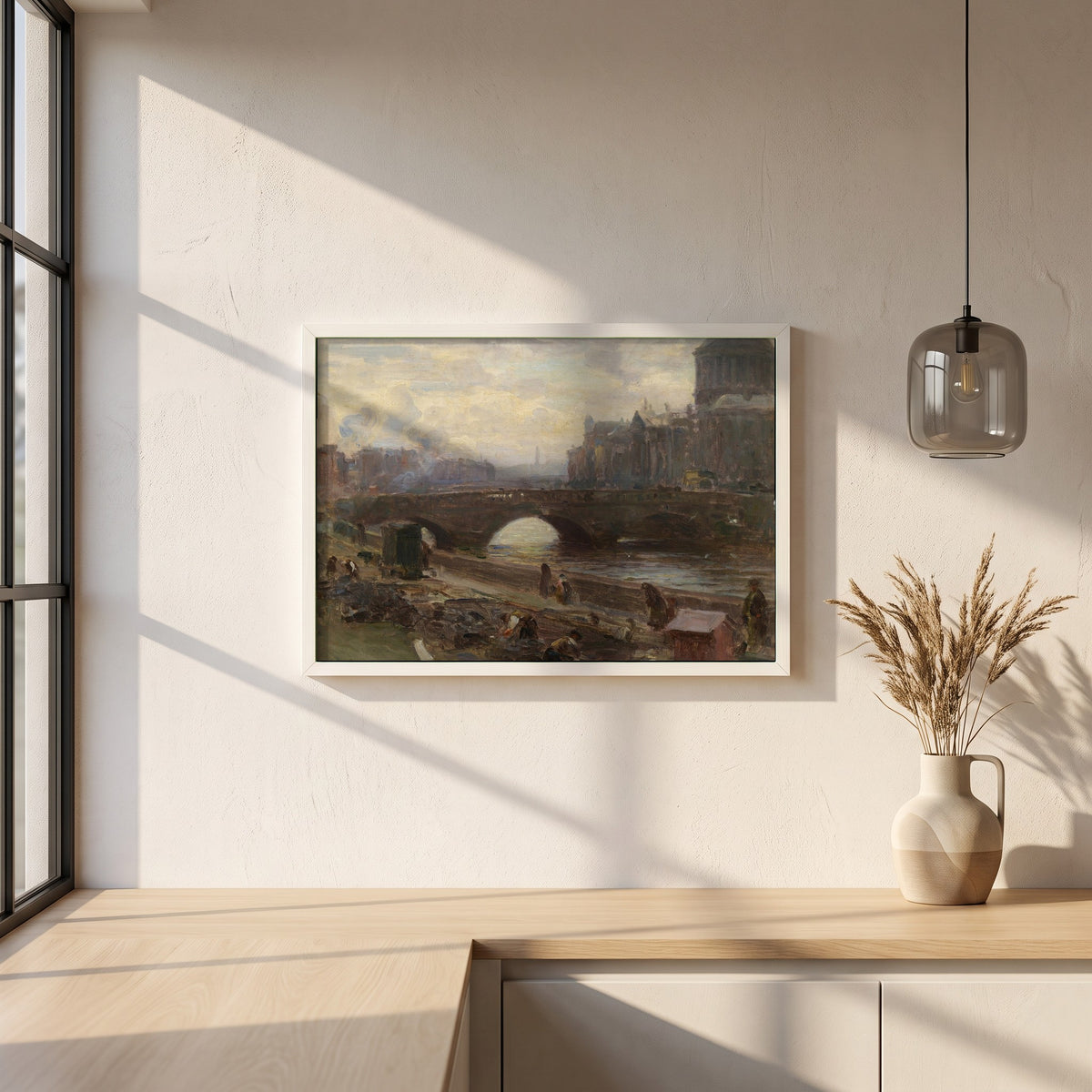 The Four Courts, Dublin framed print in a white frame on a plaster wall above an oak worktop in a bright Scandinavian kitchen