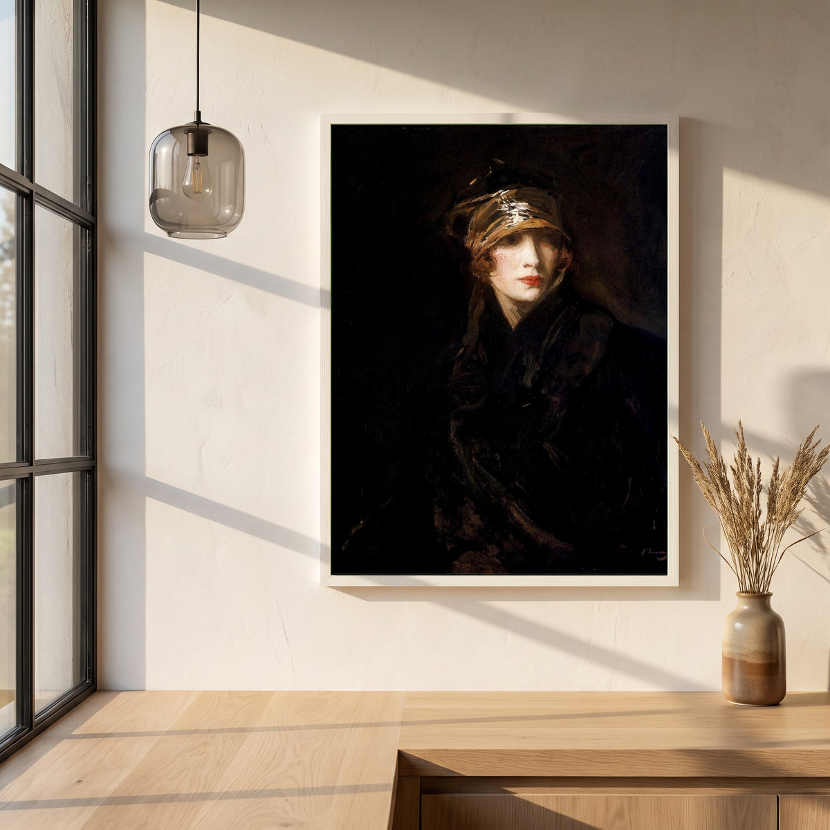 The Gold Turban framed print in a white frame on a plaster wall above an oak worktop in a bright Scandinavian kitchen