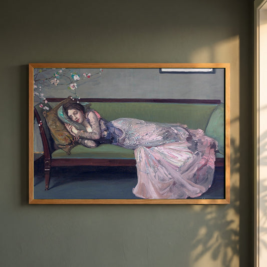 The Green Sofa framed print in a natural oak frame on a dark green wall beside a window, dappled plant shadow