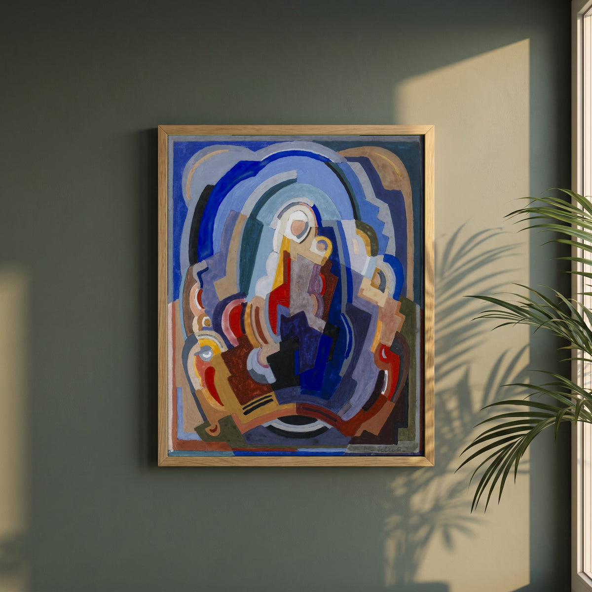 The Virgin and Child Enthroned framed print in a natural oak frame on a dark green wall beside a window, dappled plant shadow