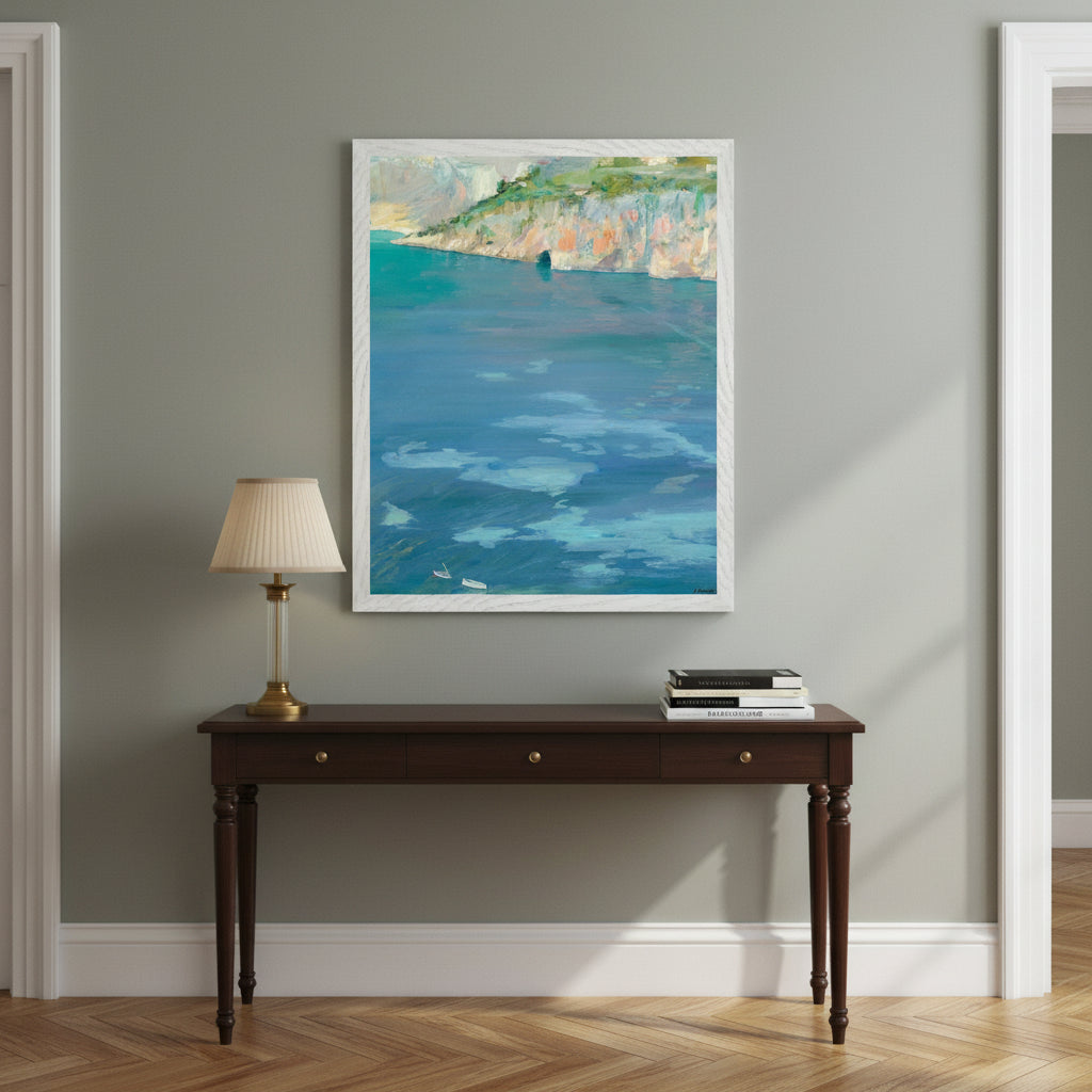 The Little White Boats, Cap Ferrat framed print in a white frame above a console table in a hallway