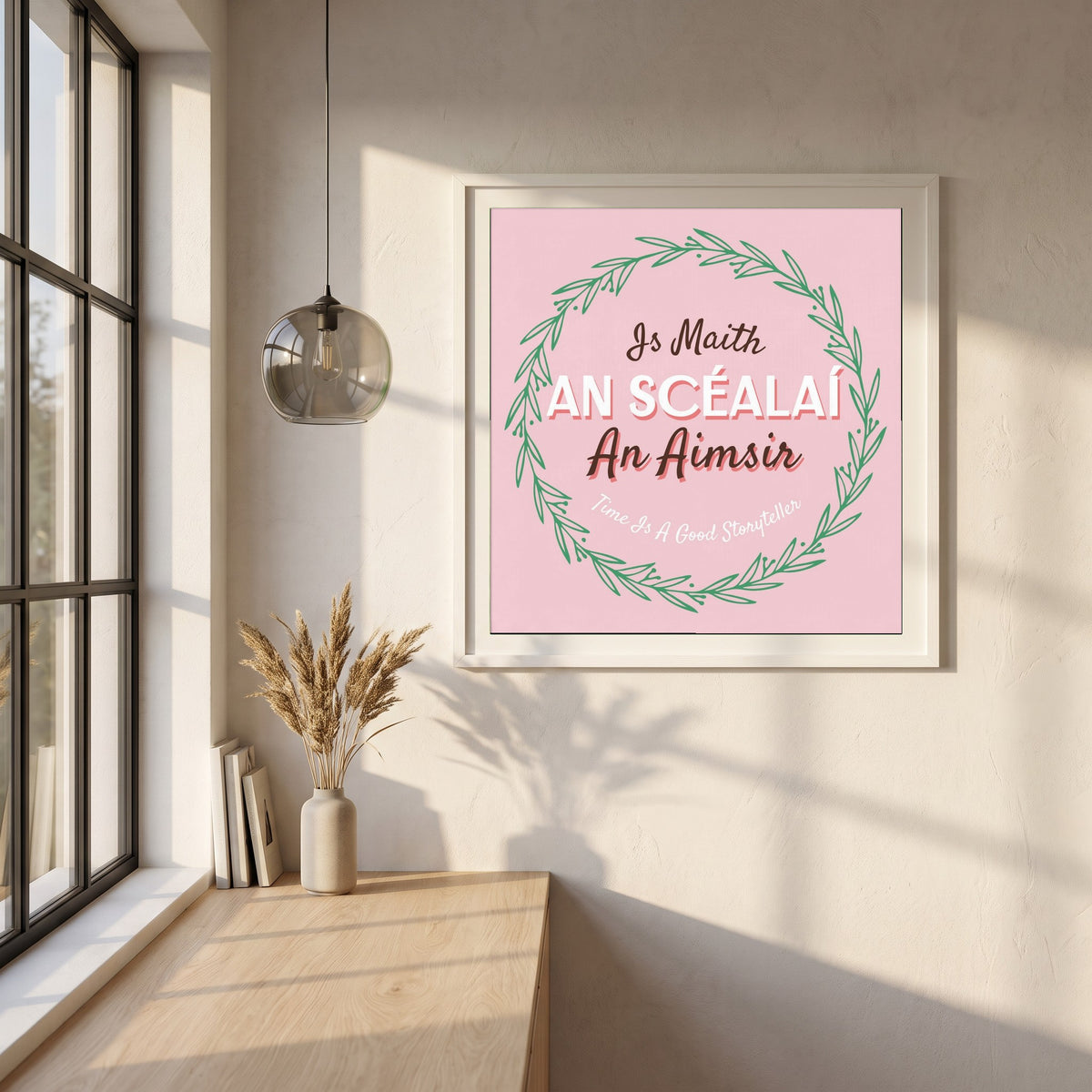 Time Is A Good Storyteller framed print in a white frame on a plaster wall above an oak worktop in a bright Scandinavian kitchen