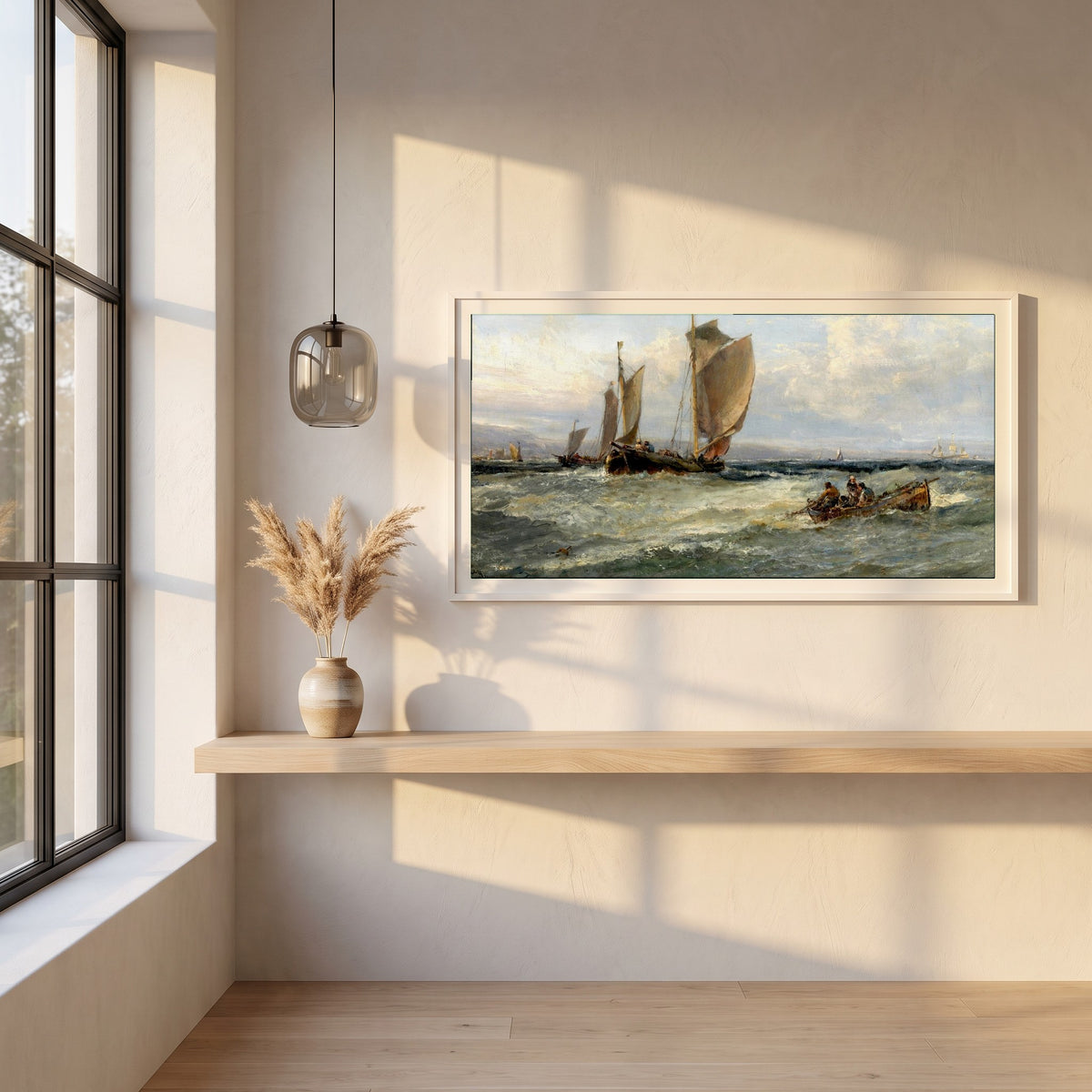 Trawlers Leaving Port framed print in a white frame on a plaster wall above an oak worktop in a bright Scandinavian kitchen