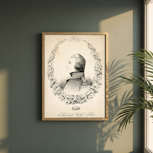 Wolfe Tone in French Uniform framed print in a natural oak frame on a dark green wall beside a window, dappled plant shadow